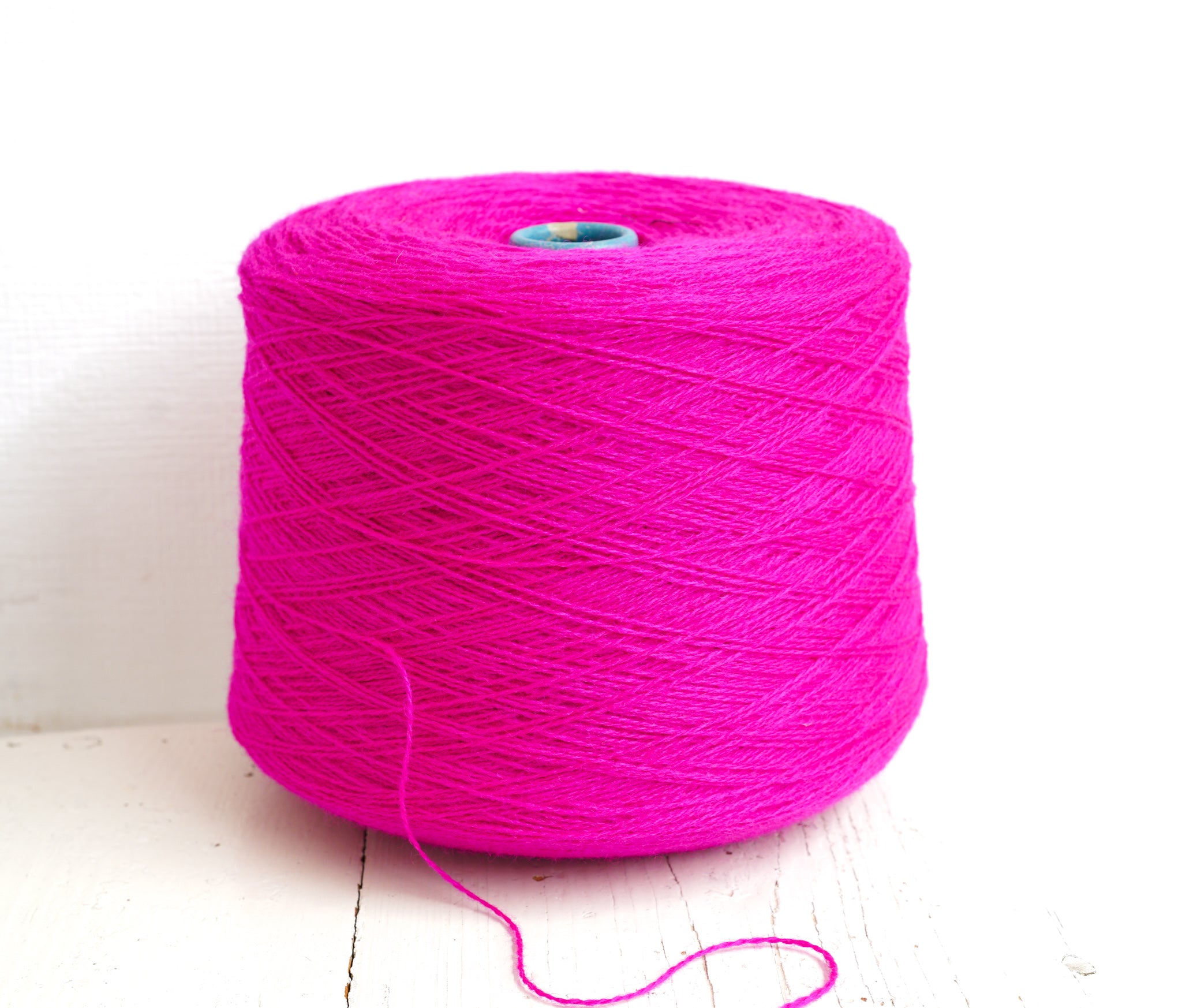 Neon pink New Zealand wool in a cone - 107