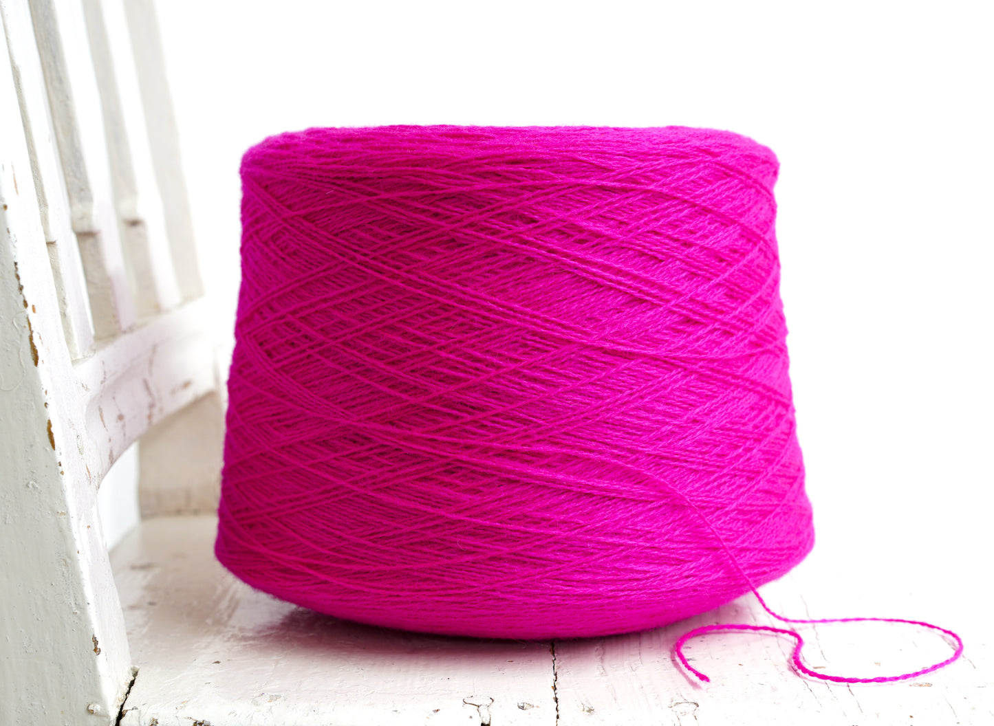 Neon pink New Zealand wool in a cone - 107