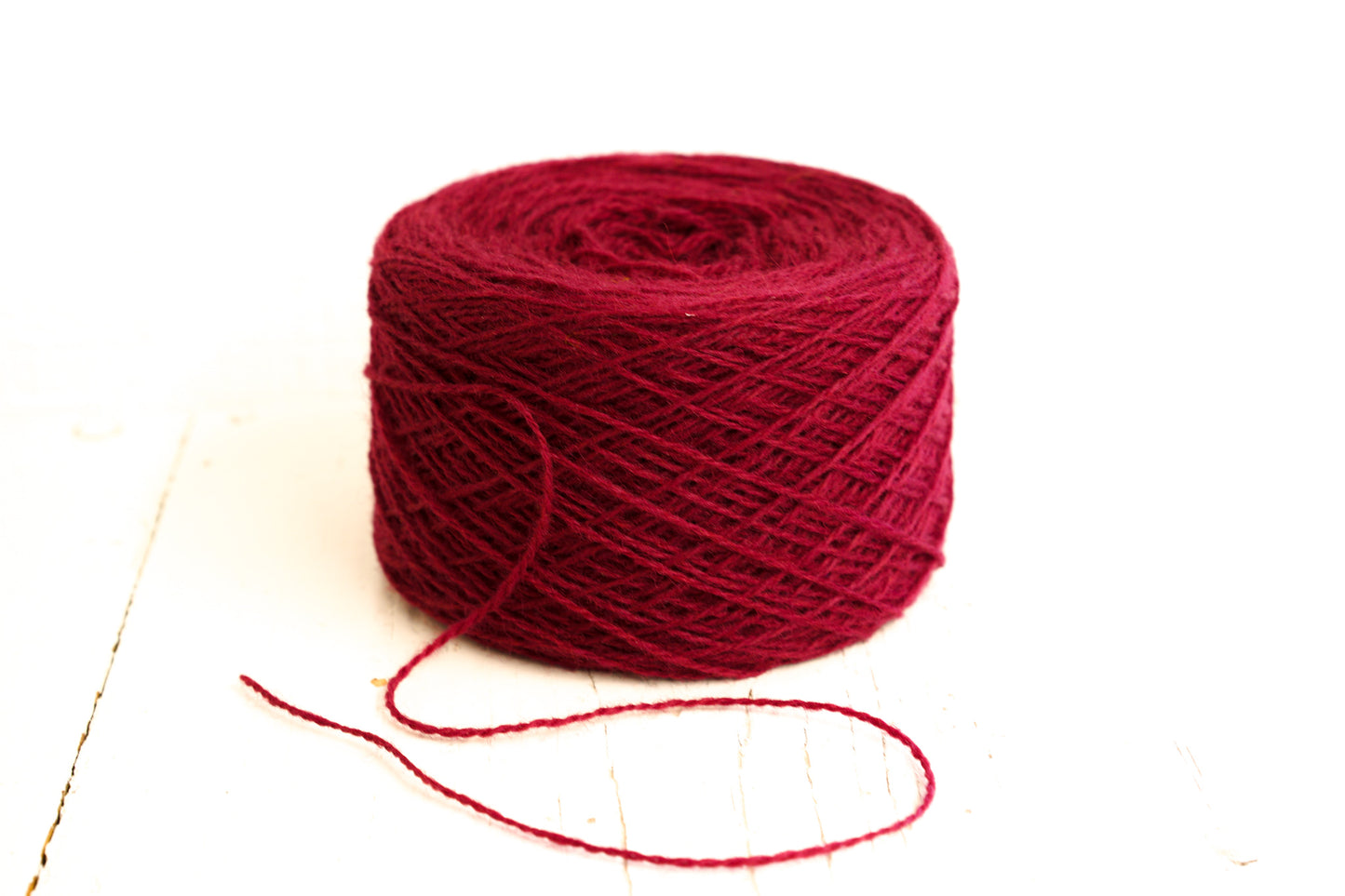 Red Wine fingering wool yarn in cones - 565