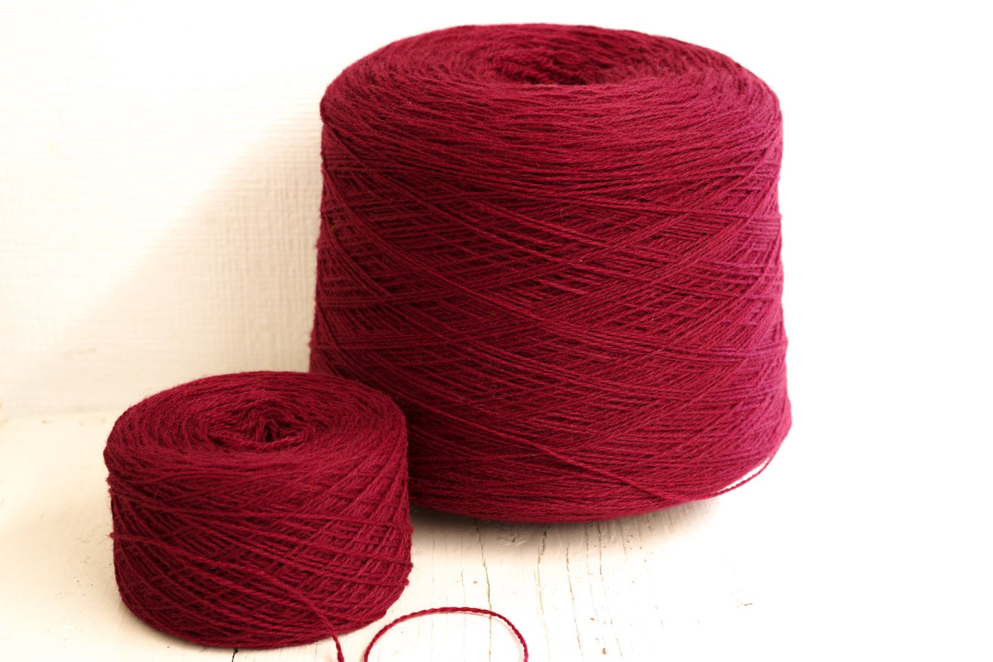 Red Wine fingering wool yarn in cones - 565