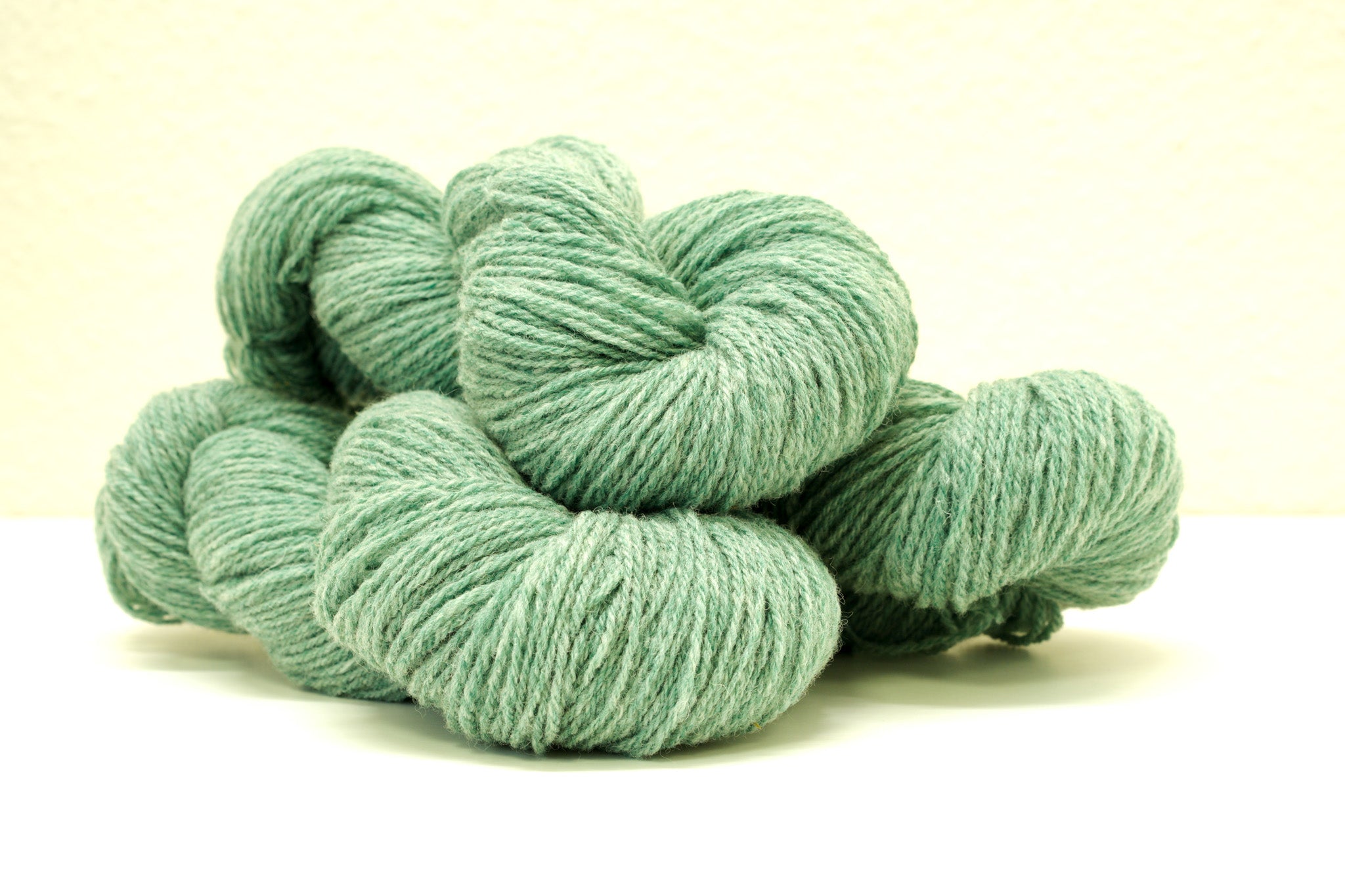 Green melange color Merino and Suffolk wool yarn blend