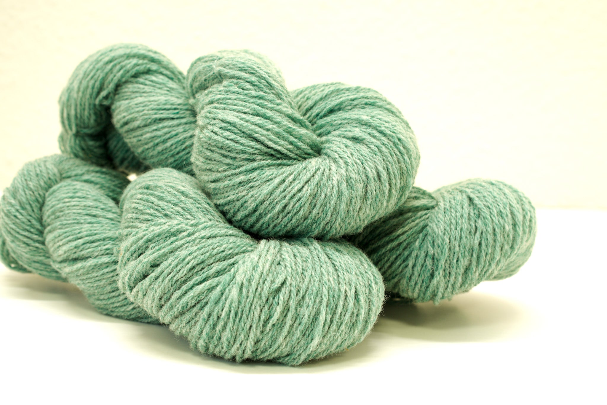 Green melange color Merino and Suffolk wool yarn blend