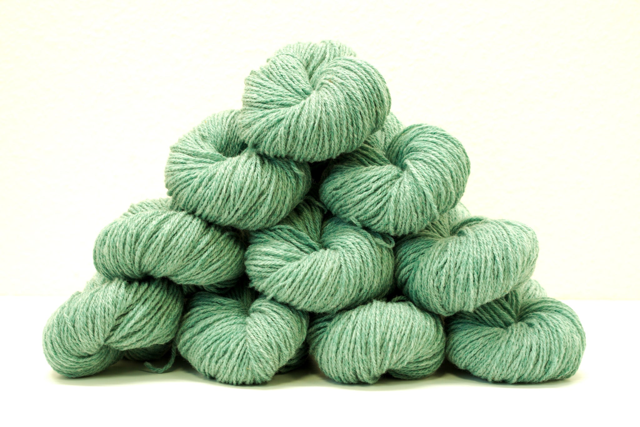 Green melange color Merino and Suffolk wool yarn blend