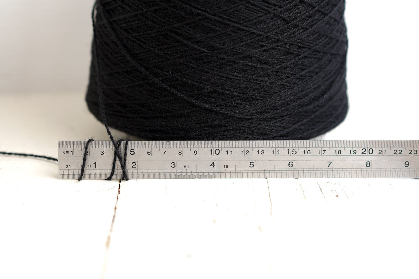 Black fingering wool yarn in cones | black-fingering-wool-yarn-in-cones
