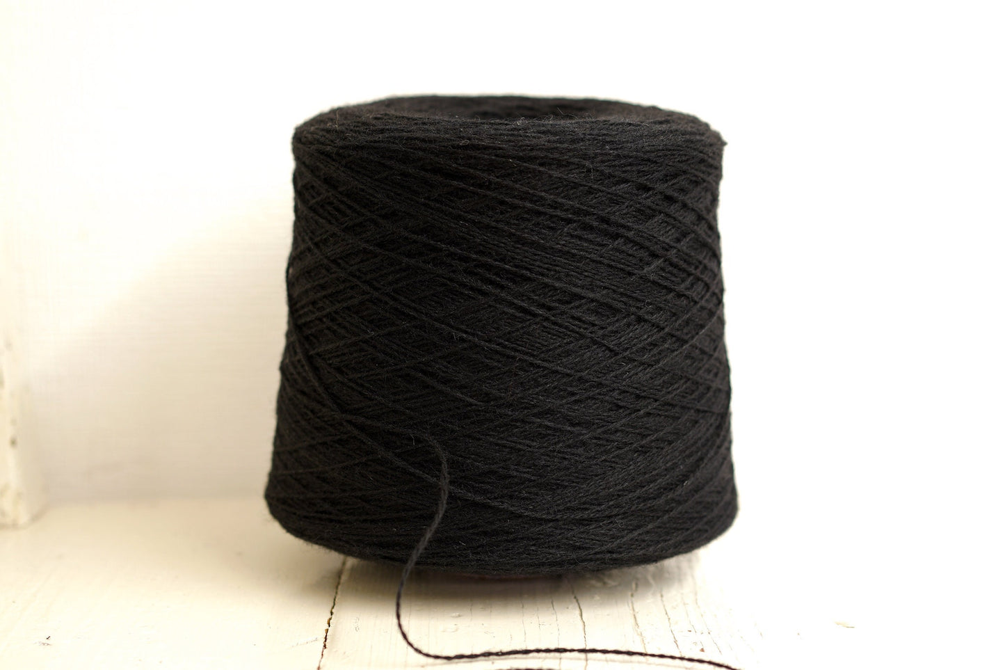 Black fingering wool yarn in cones | black-fingering-wool-yarn-in-cones
