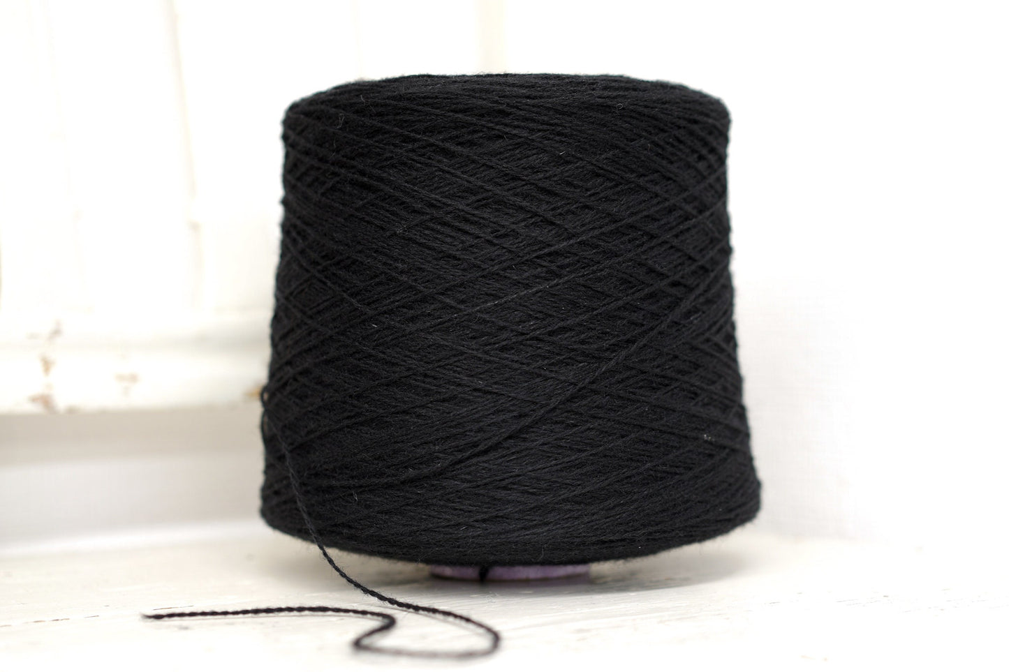 Black fingering wool yarn in cones | black-fingering-wool-yarn-in-cones