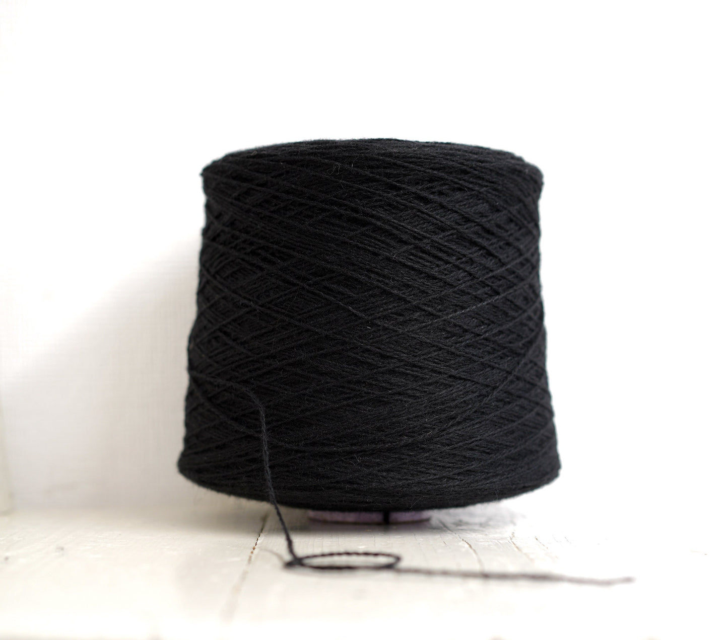Black fingering wool yarn in cones | black-fingering-wool-yarn-in-cones