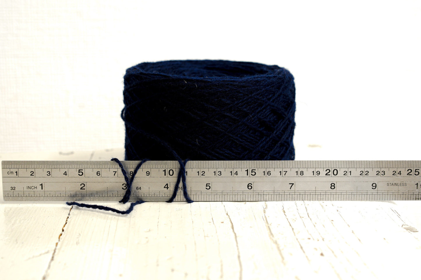 Dark blue fingering wool yarn in cones | dark-blue-fingering-wool-yarn-in-cones