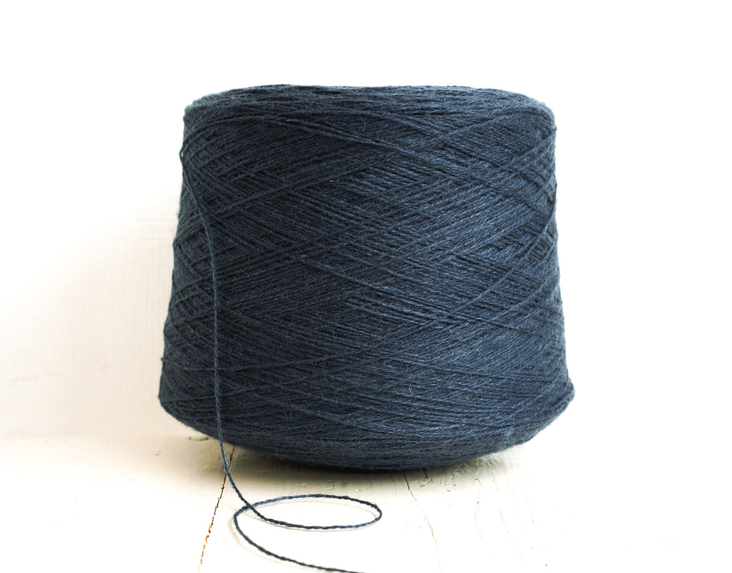 Denim blue fingering wool yarn in cones | denim-blue-fingering-wool-yarn-in-cones