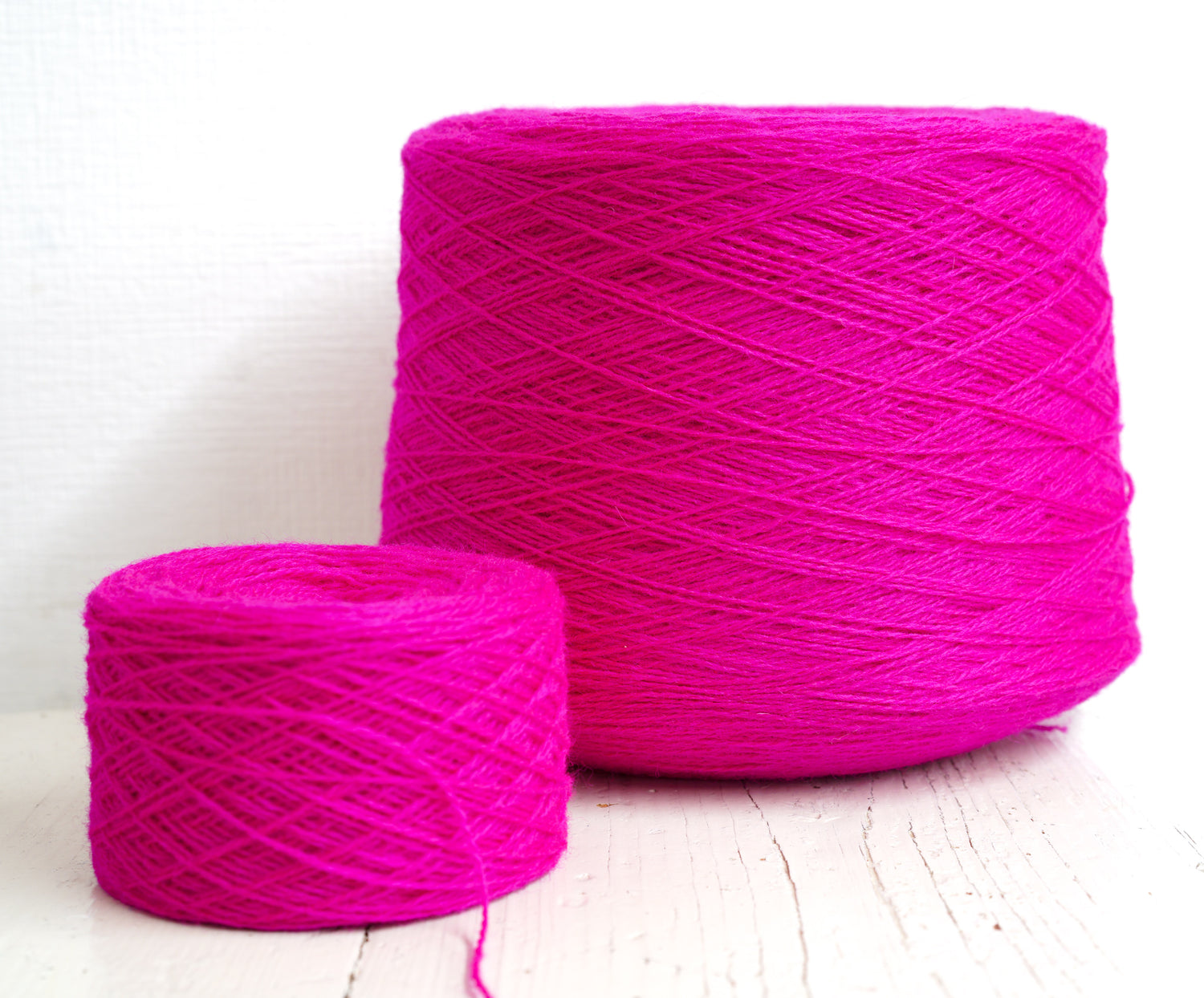 Neon pink New Zealand wool in a cone - 107