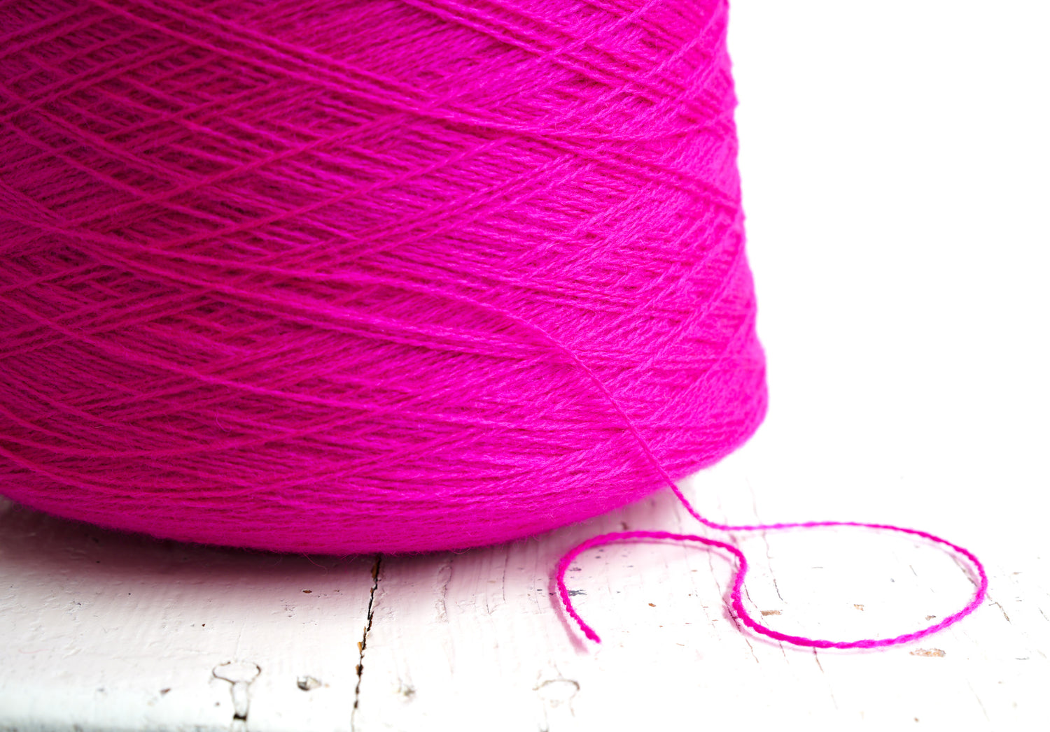Neon pink New Zealand wool in a cone - 107