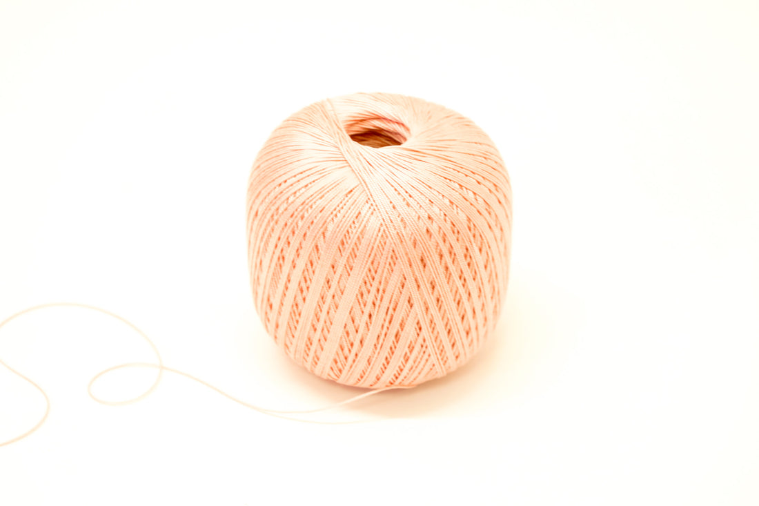 Light peach color mercerised cotton 100g/452m