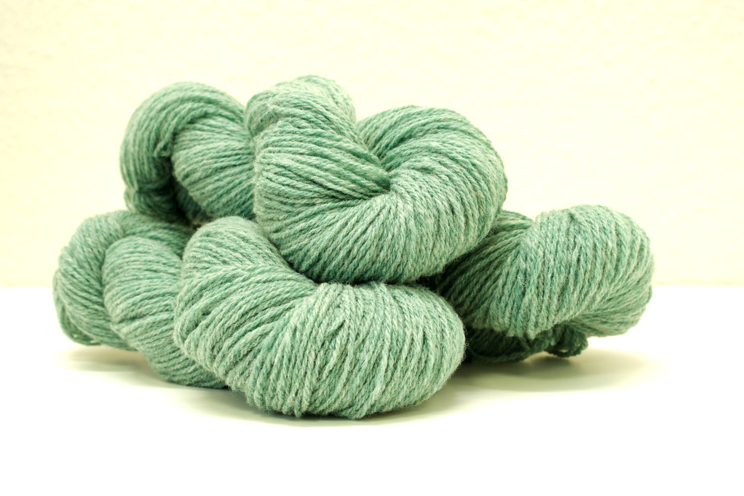 Green melange color Merino and Suffolk wool yarn blend