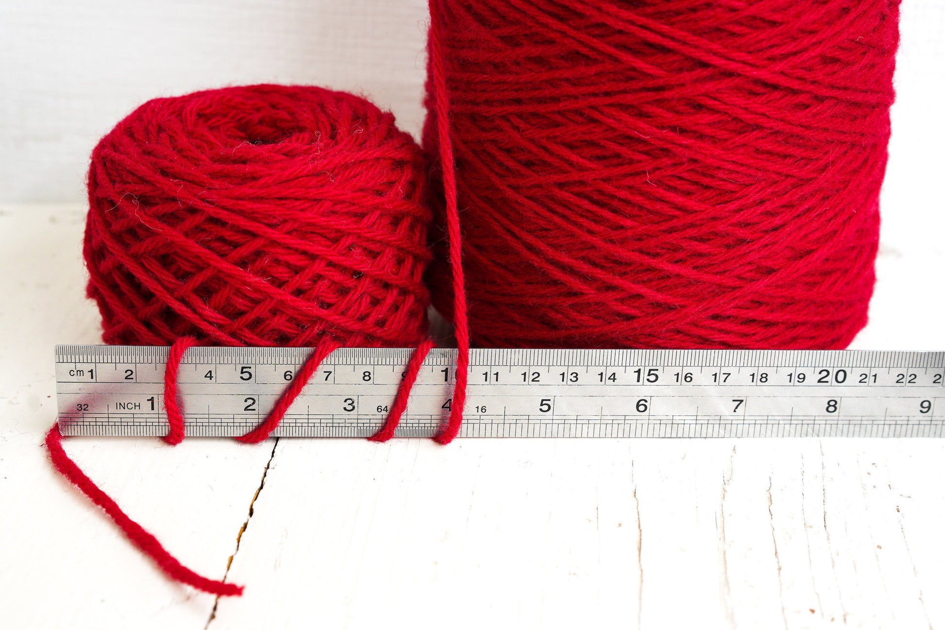 Bright red wool yarn in cones