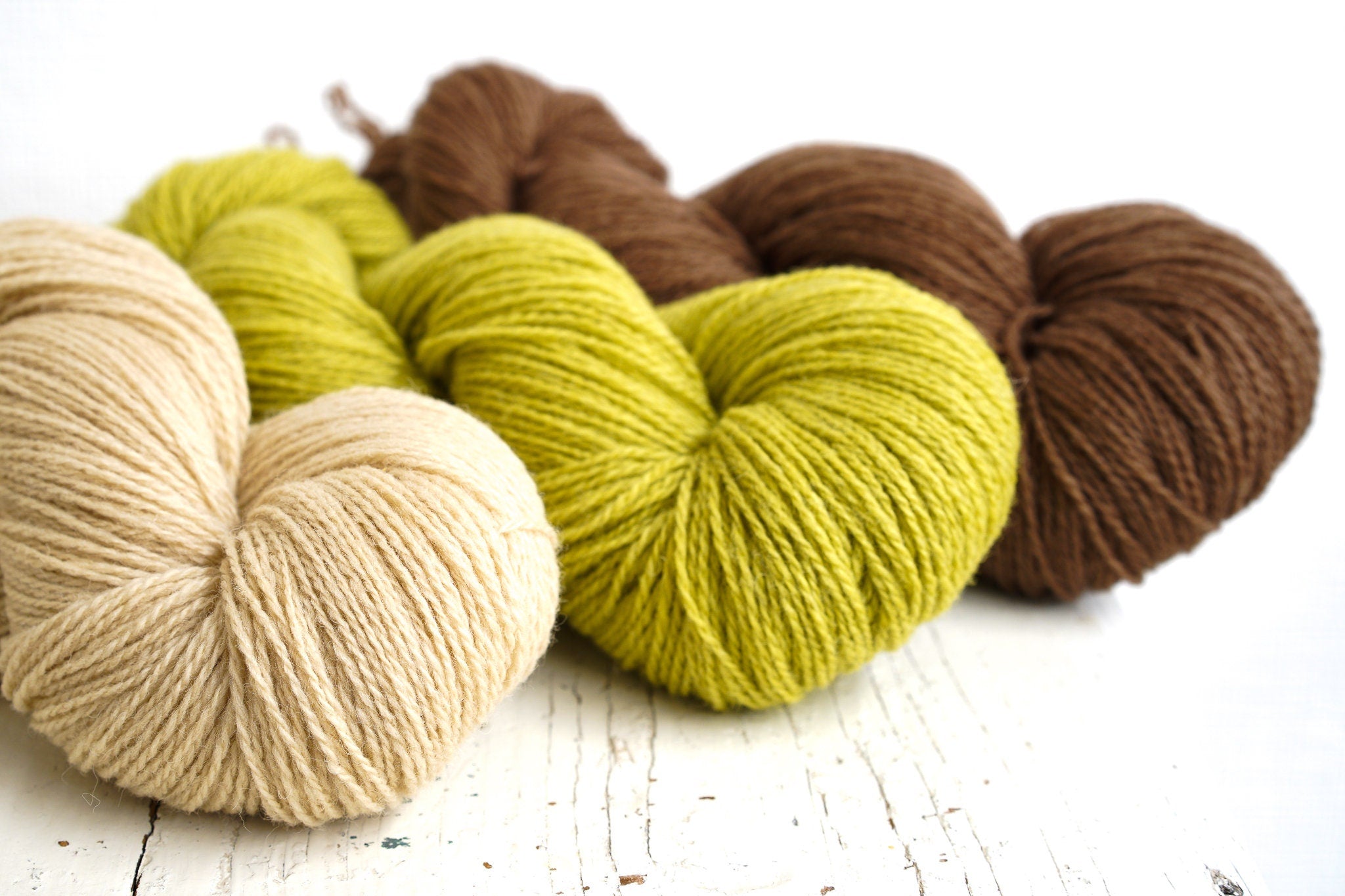 Brown and green shades of wool yarn | brown-and-green-shades-of-wool-yarn