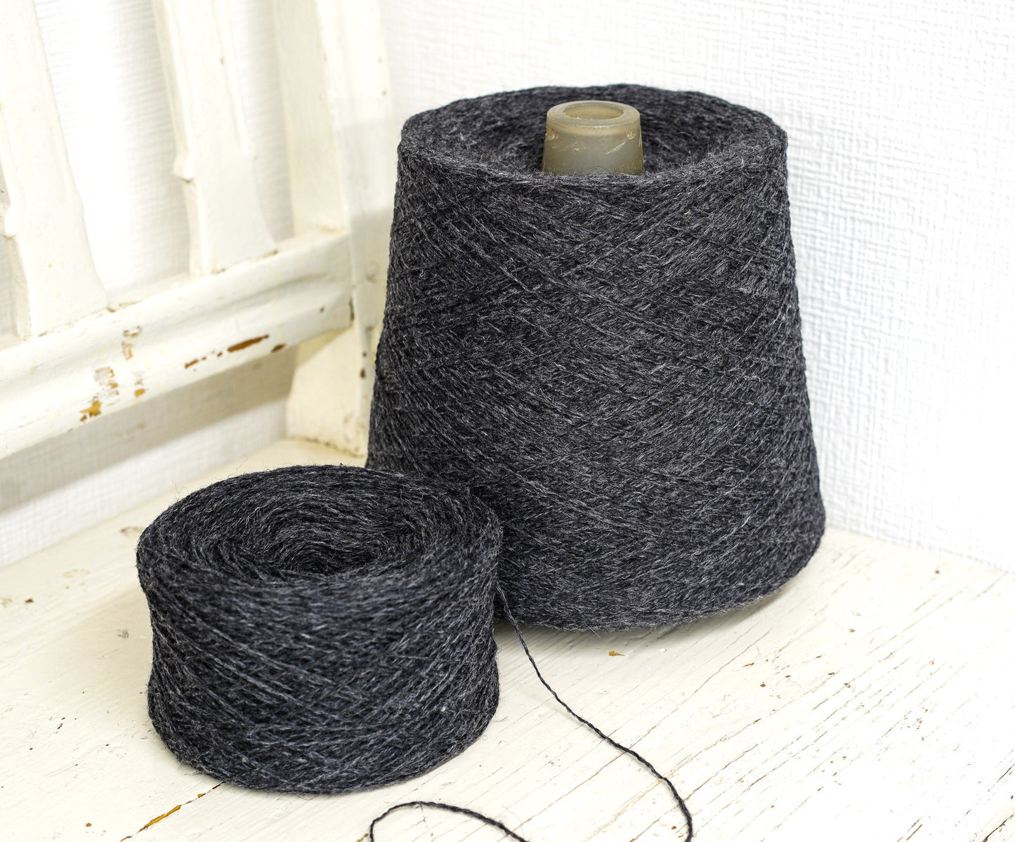 Dark grey fingering wool yarn in cones | dark-grey-fingering-wool-yarn-in-cones