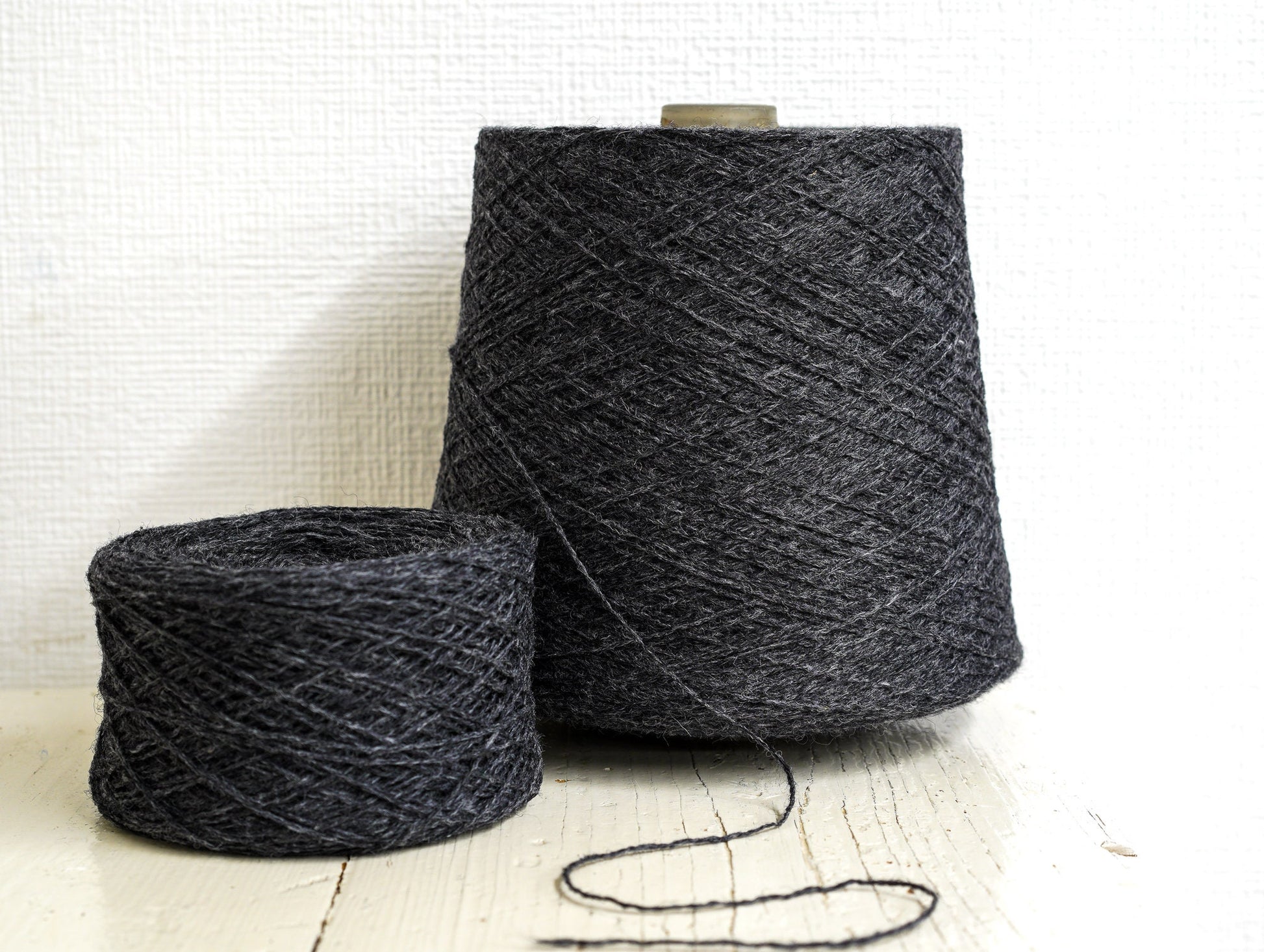Dark grey fingering wool yarn in cones | dark-grey-fingering-wool-yarn-in-cones