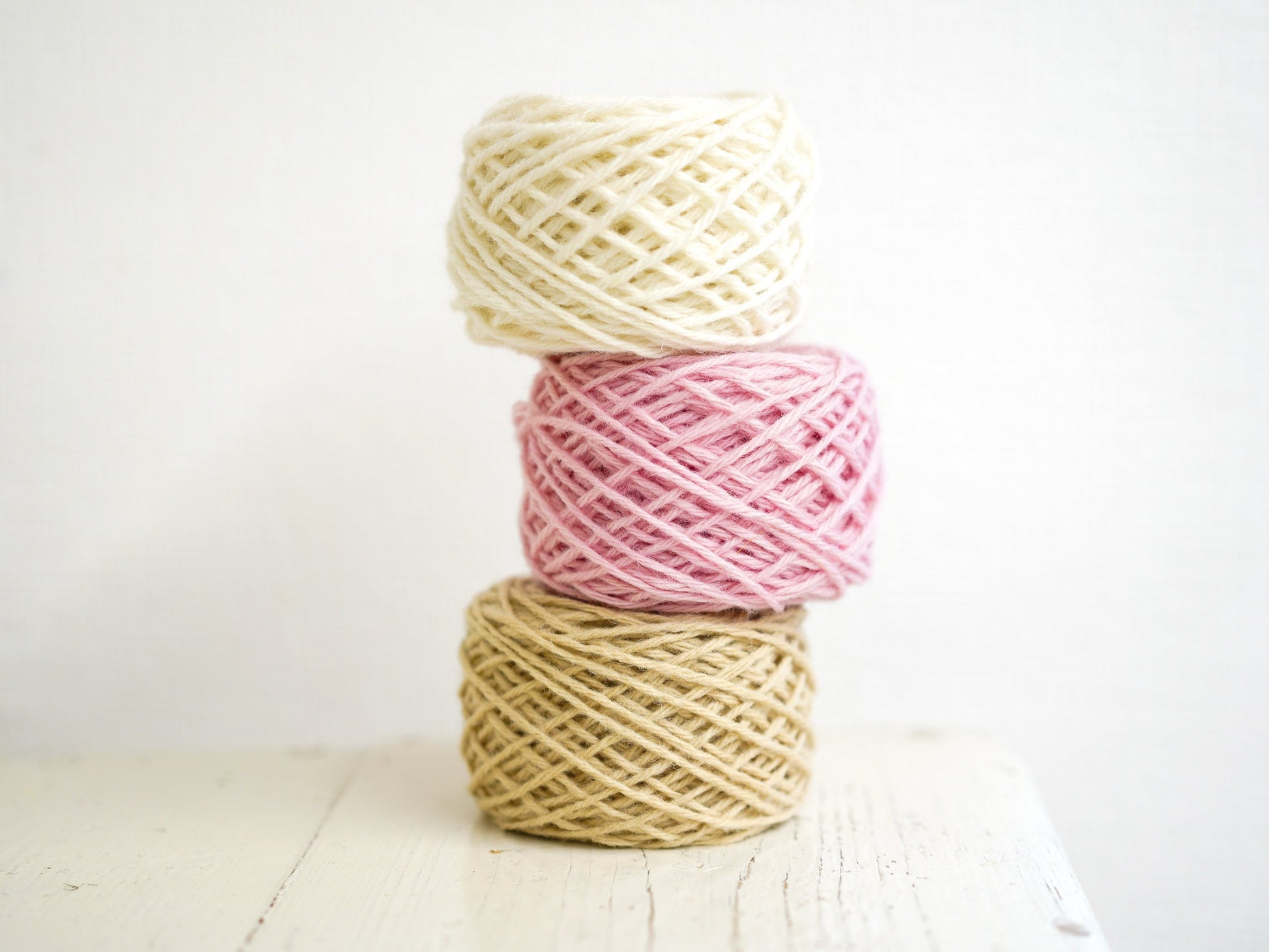White, pink, ivory wool yarn for crafts