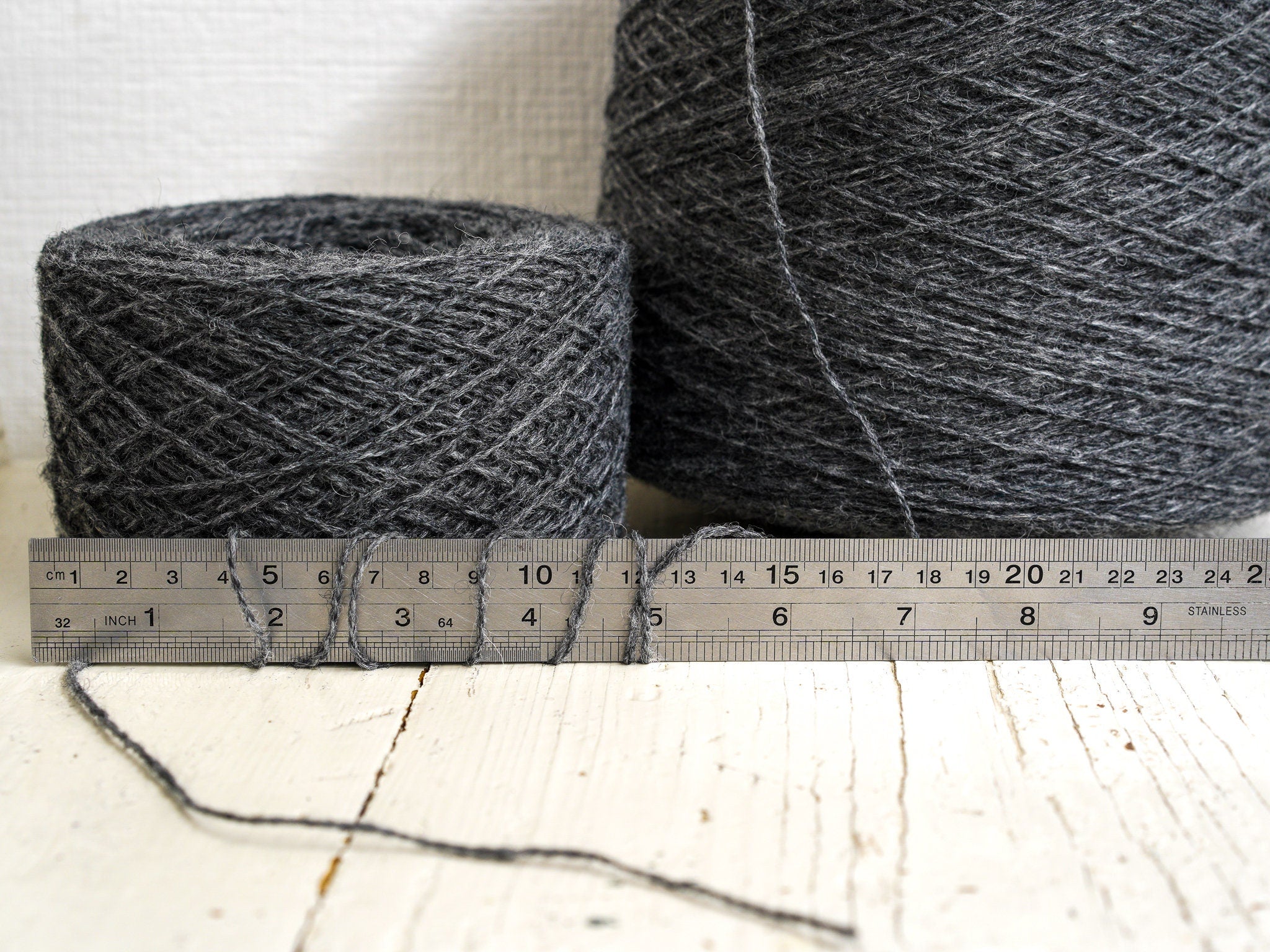 Graphite grey fingering wool yarn in cones | graphite-grey-fingering-wool-yarn-in-cones-1