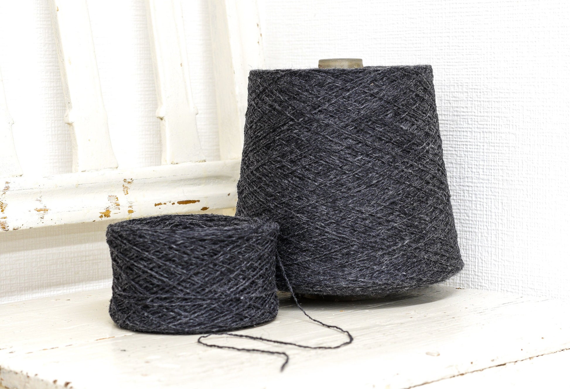 Dark grey fingering wool yarn in cones | dark-grey-fingering-wool-yarn-in-cones
