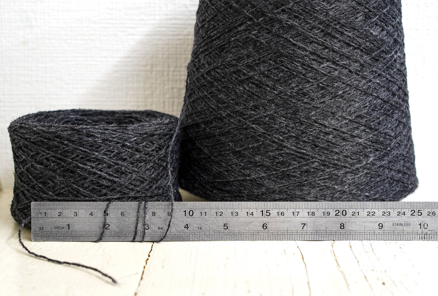 Dark grey fingering wool yarn in cones | dark-grey-fingering-wool-yarn-in-cones