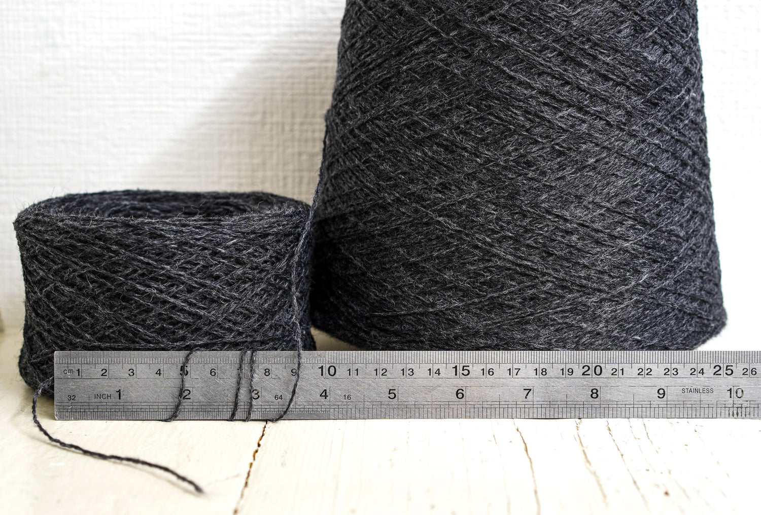 Dark grey fingering wool yarn in cones | dark-grey-fingering-wool-yarn-in-cones