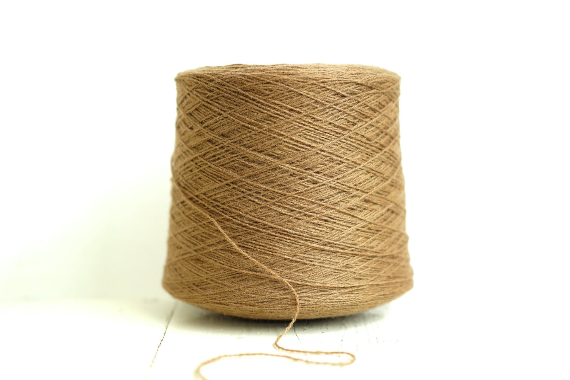 Sand brown wool yarn in cone | sand-brown-wool-yarn-in-cone
