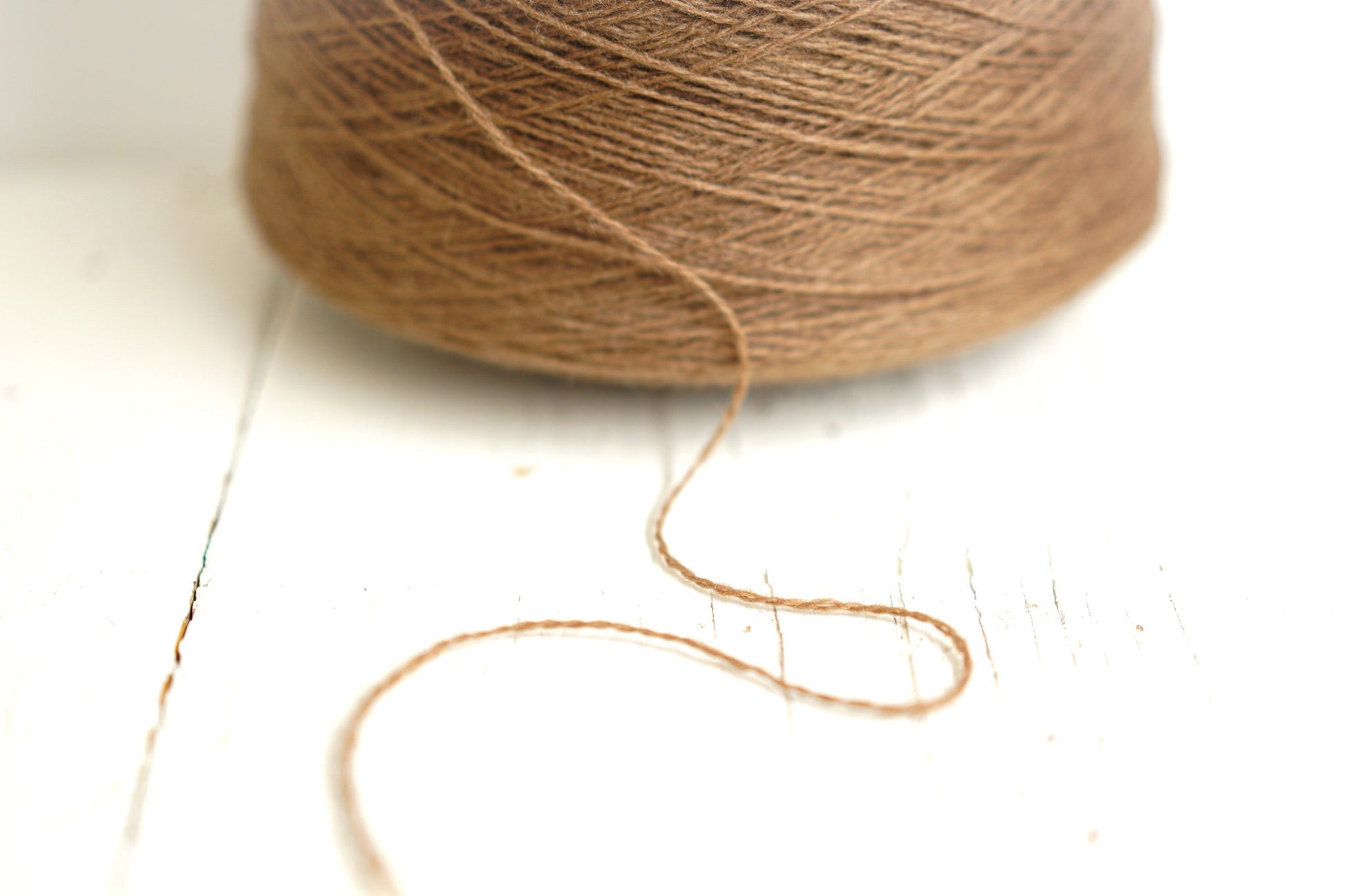 Sand brown wool yarn in cone | sand-brown-wool-yarn-in-cone