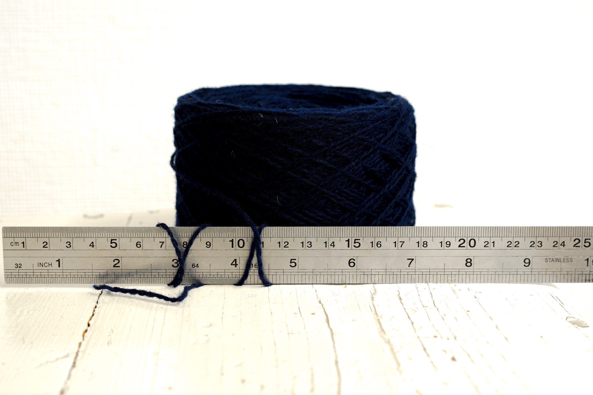 Dark blue fingering wool yarn in cones | dark-blue-fingering-wool-yarn-in-cones