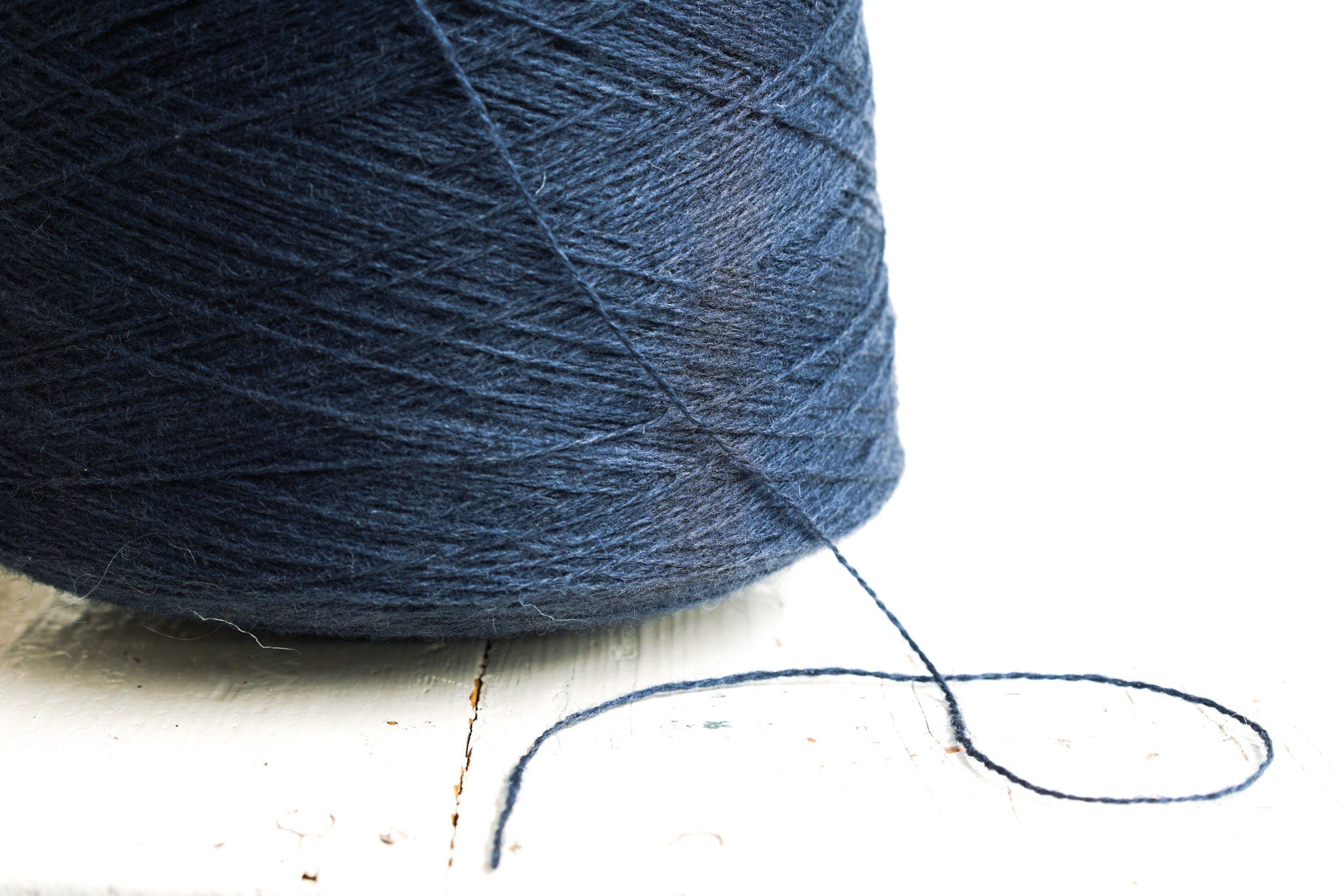 Denim blue fingering wool yarn in cones | denim-blue-fingering-wool-yarn-in-cones