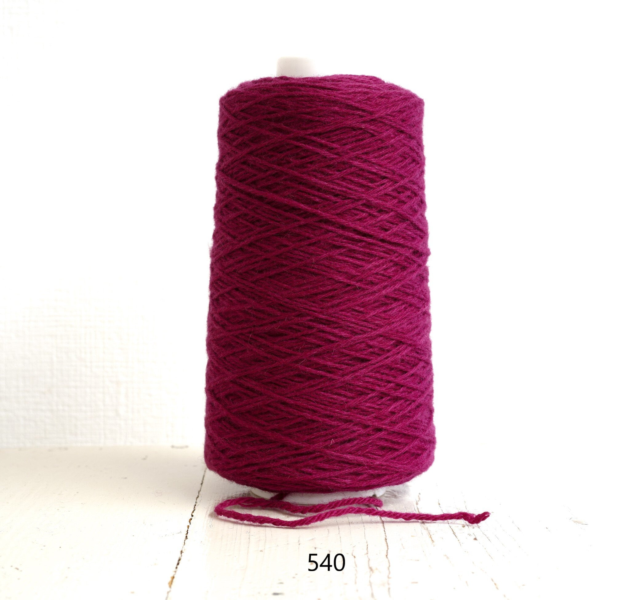 Bright rose wool yarn in a cone | bright-rose-wool-yarn-in-a-cone