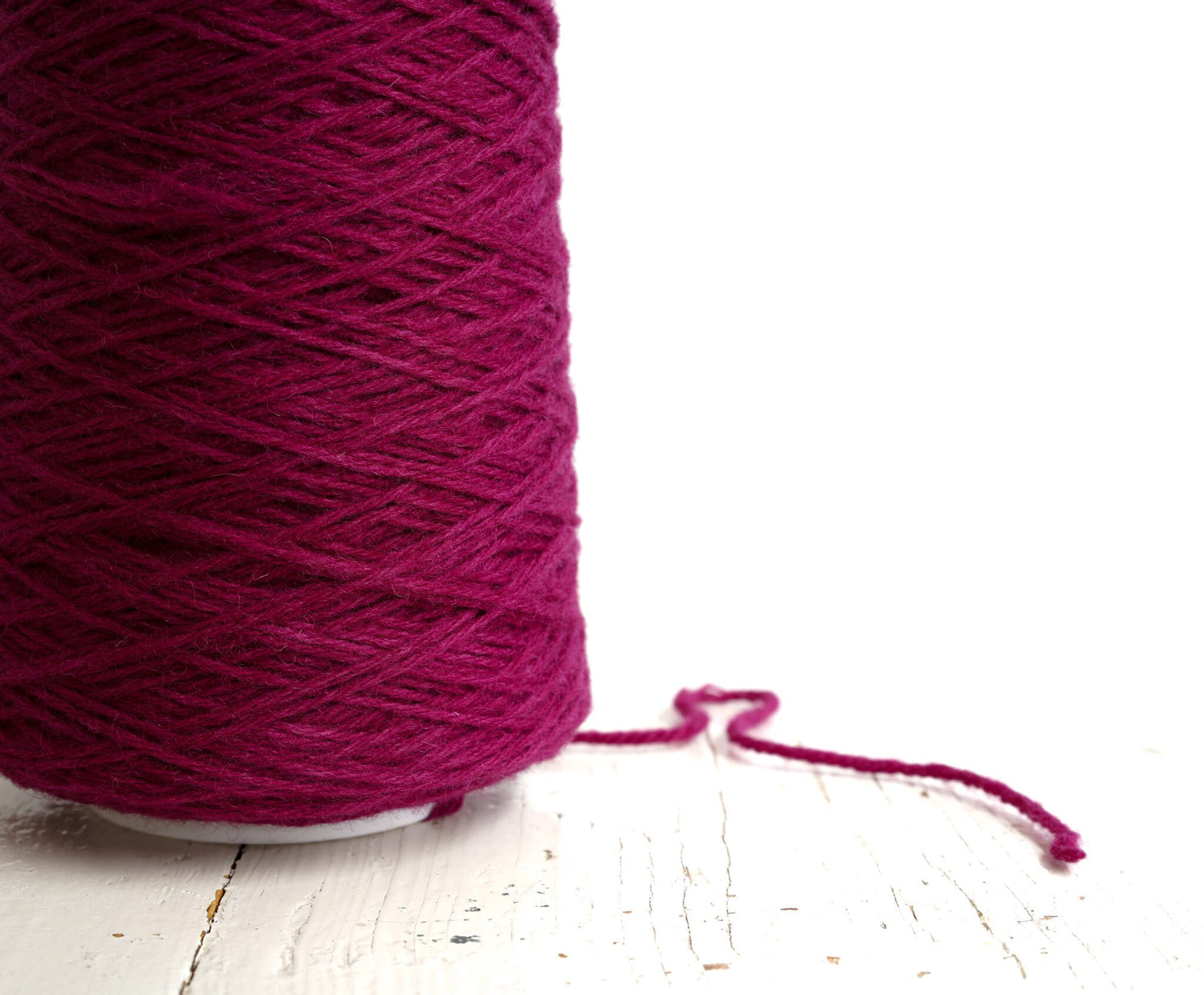 Bright rose wool yarn in a cone | bright-rose-wool-yarn-in-a-cone