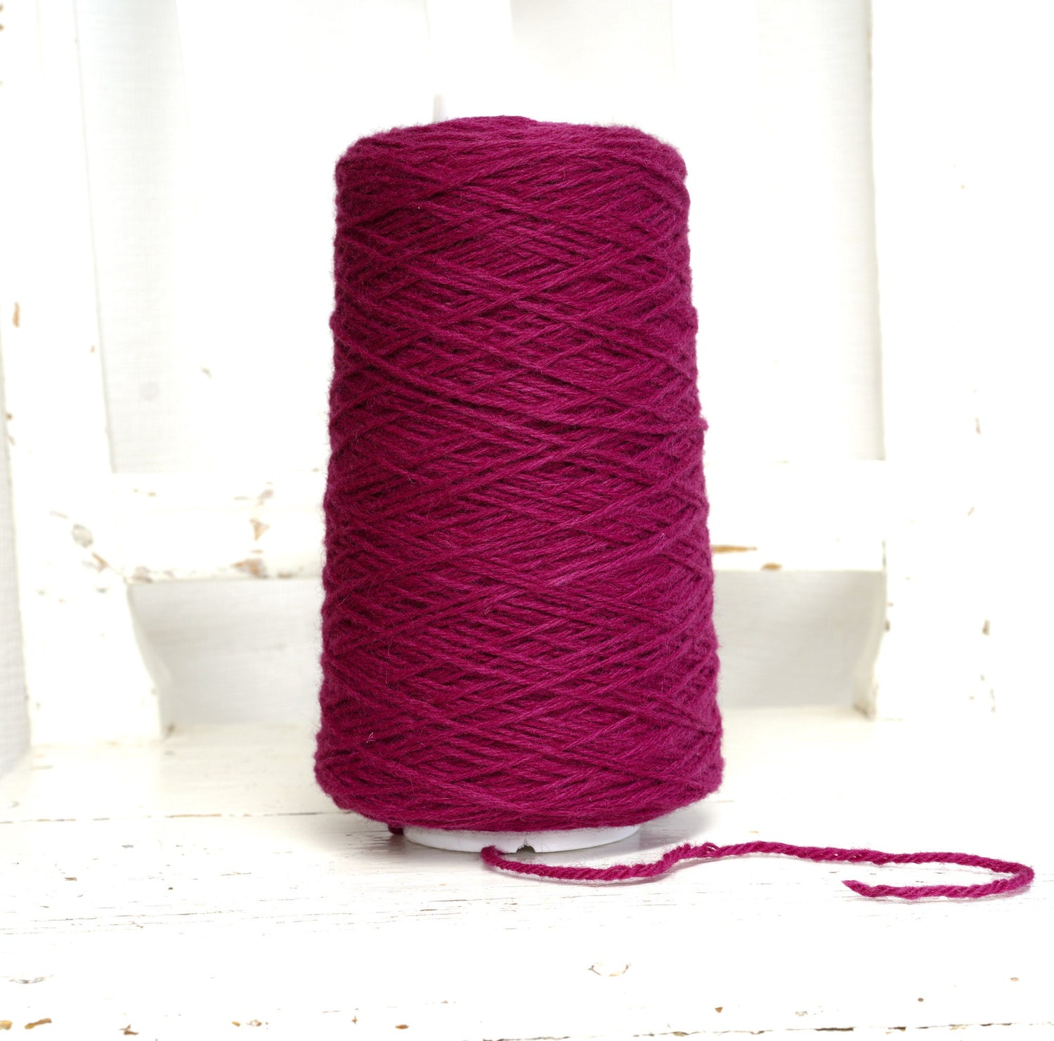 Bright rose wool yarn in a cone | bright-rose-wool-yarn-in-a-cone