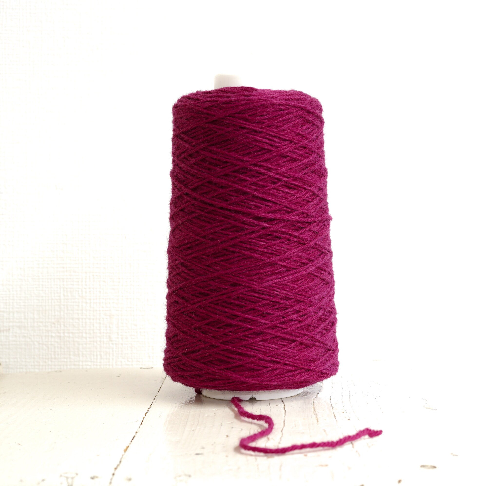 Bright rose wool yarn in a cone | bright-rose-wool-yarn-in-a-cone